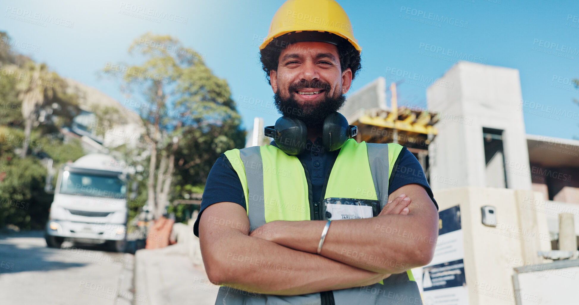 Buy stock photo Construction, portrait and happy man outdoor with helmet for renovation, remodeling or architecture. Contractor, low angle and person with ppe for property development, building and crossed arms