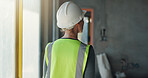 Woman, back and inspection for construction, contractor compliance or progress on site with helmet. Safety manager, maintenance and quality assurance for renovation, engineering or project management