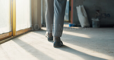 Buy stock photo Person, legs and inspection for construction, contractor compliance or progress on site with walk. Safety manager, maintenance or quality assurance for renovation, engineering or project management