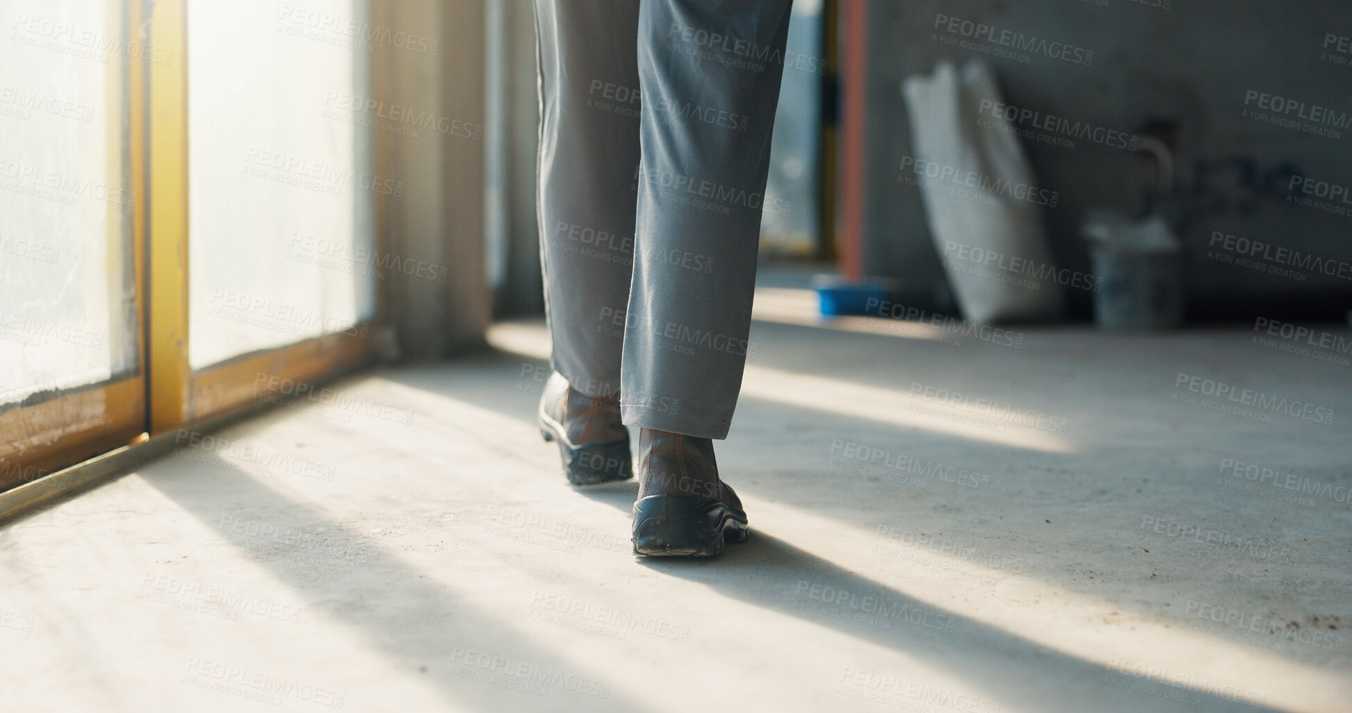 Buy stock photo Person, legs and inspection for construction, contractor compliance or progress on site with walk. Safety manager, maintenance or quality assurance for renovation, engineering or project management