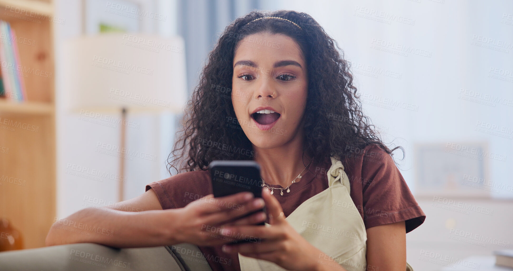 Buy stock photo Phone, shock and woman on sofa in home with texting, social media or networking on mobile app. Surprise, relax and person with cellphone for reading blog on celebrity gossip in living room at house.