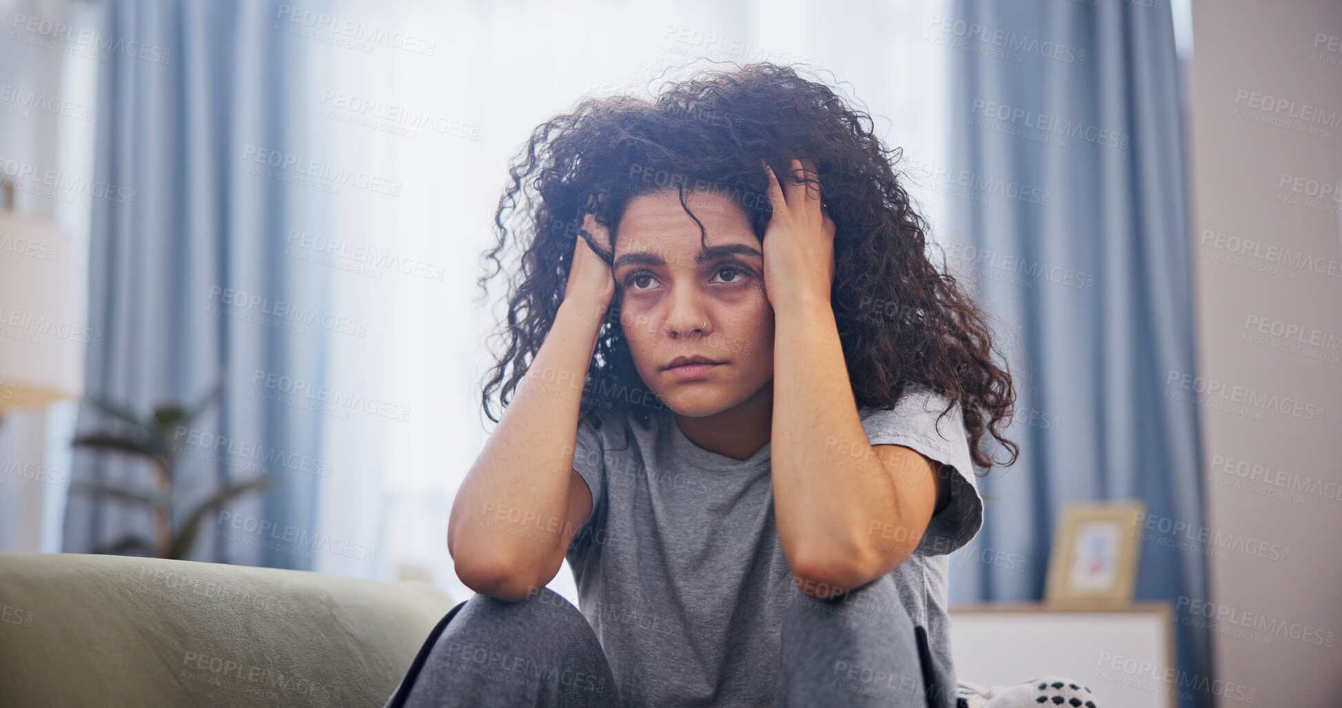 Buy stock photo Woman, tired and anxiety on sofa in home with headache, mental health crisis and frustrated. Psychology, person with depression and tension with stress, trauma and sad on couch in living room