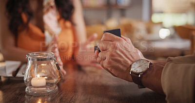 Buy stock photo Couple, hands and proposal in restaurant, date and relationship commitment with ring and connection. Love, celebration and asking for marriage, engagement and people in diner or bonding with partner