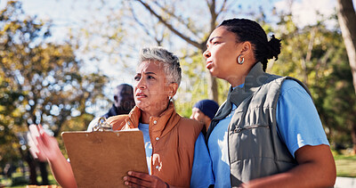 Buy stock photo Clipboard, instructions and pointing with volunteer people in park together for charity or relief work. Conversation, inventory and paperwork with community team outdoor for discussion or planning