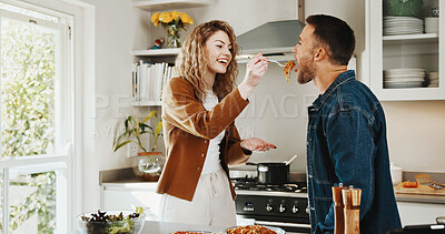 Buy stock photo Cooking, support or couple in kitchen with taste, fun connection or bonding together in meal prep. Love, food sampling or people with romantic moment, happy relationship or culinary hobby in house.