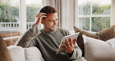 Buy stock photo Tablet, happy and man on sofa in home with texting, communication or social media on app. Smile, relax and person with digital technology for online chatting with connection in living room at house.