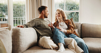 Buy stock photo Couple, relax and talking at house with smile, love and partner support for bonding together. Happy, people and unwind in lounge with spouse, comfortable and relationship commitment for weekend break