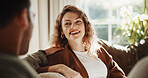 Woman, couple and relax at house with smile, love and partner support for bonding together. Happy, people and unwind in lounge with spouse, comfortable and relationship commitment for weekend break