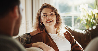 Buy stock photo Woman, couple and relax at house with smile, love and partner support for bonding together. Happy, people and unwind in lounge with spouse, comfortable and relationship commitment for weekend break