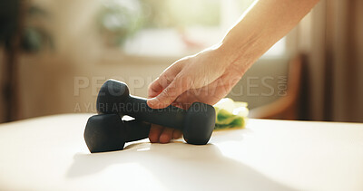 Buy stock photo Fitness, hand and pick up dumbbells for exercise, wellness or strength development for power. Workout gear, equipment and person with weights to start resistance training, practice and health in home