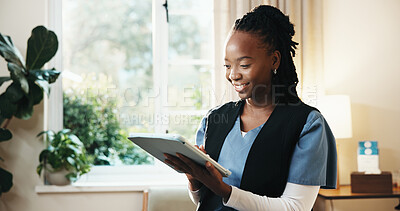 Buy stock photo Review, happy woman and nurse with tablet for healthcare, homecare schedule or wellness report. Tech, caregiver and African person in house for medical records, reading info or smile for results