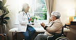 Doctor, pills and old woman in clinic with wheelchair, medical advice and chronic drugs for health. Healthcare worker, talk and senior person with disability, prescription medicine and instructions.