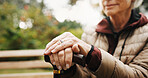 Hands, cane and thinking outdoor with senior person in retirement, balance aid and reflection space. Old woman, memory or nostalgia for past perspective, relax in nature or walking stick for mobility