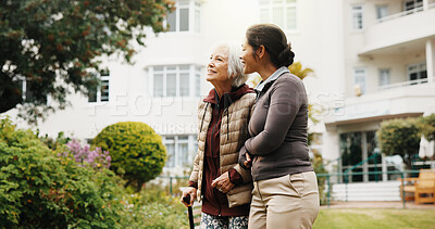 Buy stock photo Help, caregiver and old woman with walking stick outdoor for support, smile and connection. Retirement home, cane and person with carer in garden for rehabilitation assistance, happiness and wellness