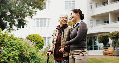 Buy stock photo Help, caregiver and old woman with cane at backyard for support, smile and connection. Retirement home, walking stick and person with carer in garden for rehabilitation assistance, happy and wellness