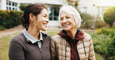 Buy stock photo Happy, senior and woman with physiotherapist in retirement garden for health or outdoor wellness. Female people, laughing or smile with elderly patient for conversation or friendly discussion in park