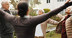Woman, physiotherapist or breathing with senior group in garden for outdoor exercise together. Female person, fitness or instructor stretching with elderly people for health or wellness in retirement