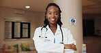 Black woman, portrait and smile for healthcare with doctor in hospital, medical help and ambitious surgeon in lobby. Pride, confidence and happy person with health profession, empowerment and career