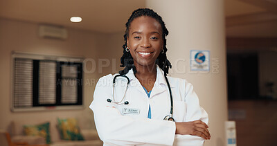 Buy stock photo Black woman, portrait and smile for healthcare with doctor in hospital, medical help and ambitious surgeon in lobby. Pride, confidence and happy person with health profession, empowerment and career