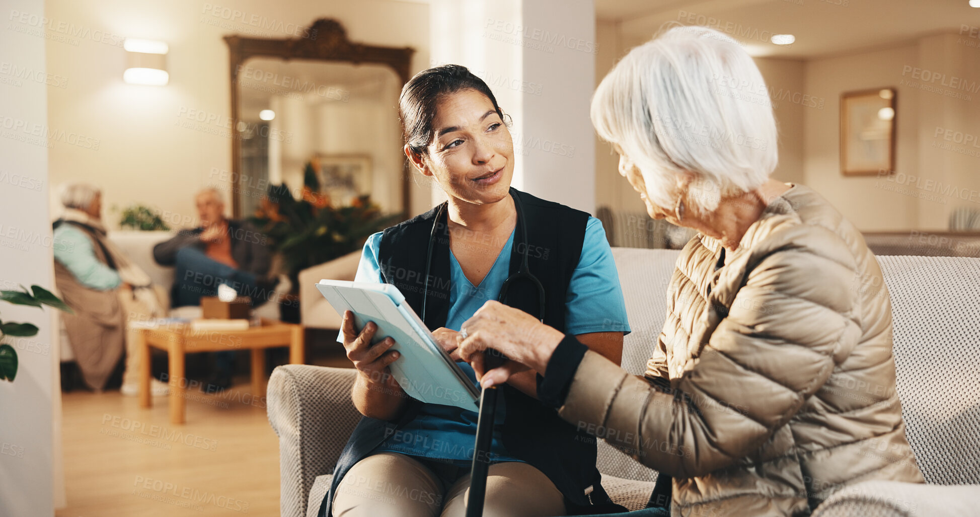 Buy stock photo Caregiver, tablet and old woman on sofa with conversation, support or consultation in nursing home. Homecare, senior person with cane and nurse with healthcare, feedback and review in living room