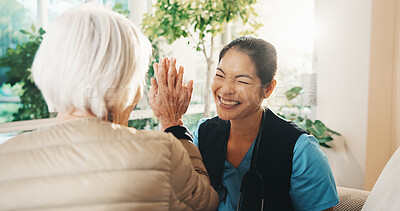 Buy stock photo Consultation, high five and old woman with caregiver for conversation, support or service in nursing home. Homecare, senior person and nurse with healthcare, feedback and good news in living room