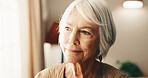 Thinking, calm and senior woman by window in home with memory, remember or planning retirement. Smile, decision and elderly person in living room with choice, reflection or nostalgia in house.