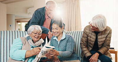 Buy stock photo Retirement, caregiver and crossword with people in home for puzzle, reading book or memory game. Carer, senior group and cognitive activity with flare, word search or brain teaser with happy friends