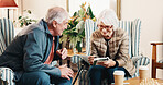 Smile, old couple and reading at house with crossword, word search and quiz for health. Senior people, helping and book in home with sudoku games, problem solving and puzzle activity for brain teaser