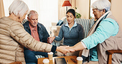Buy stock photo Elderly, group and holding hands with caregiver for praying, social support or belief together in home. Senior, people and therapy session with patients in retirement circle for faith, trust or love