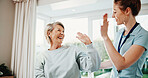 Happy, physiotherapist and woman in clinic with high five, recovery goals or complete injury treatment. Healthcare worker, mature person and celebration with rehabilitation success, wellness and help