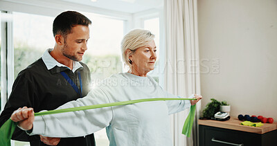 Buy stock photo Physio, woman and stretching in clinic with resistance band, support and movement for healing injury. Mature person, physical therapy and equipment with exercise, rehabilitation or healthcare worker.