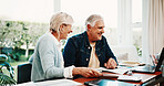 Paperwork, finance and senior couple on laptop for budget planning, digital payment and mortgage. Marriage, retirement and happy man with woman with savings, financial report and online banking