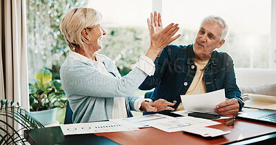 Buy stock photo Paperwork, finance and senior couple high five for budget planning, mortgage payment and success. Celebrate, marriage and happy man with woman with savings, financial report and loan approval in home