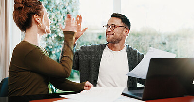 Buy stock photo Couple, laptop or high five with documents for finance, investment or good audit in home. Happy man, woman or invoice with celebration or paperwork for financial planning, budget or bills in house