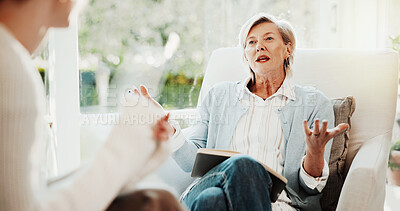 Buy stock photo Woman, therapist and talking in office for counseling, assessment and advice for mental health. Life coach, explain and notebook in workplace for therapy session, evaluation and rehabilitation report
