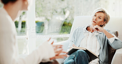 Buy stock photo Therapy, psychologist and woman in consultation, listening or writing notes for mental health evaluation. Counseling session, patient and talk with person for assessment, notebook and help in office