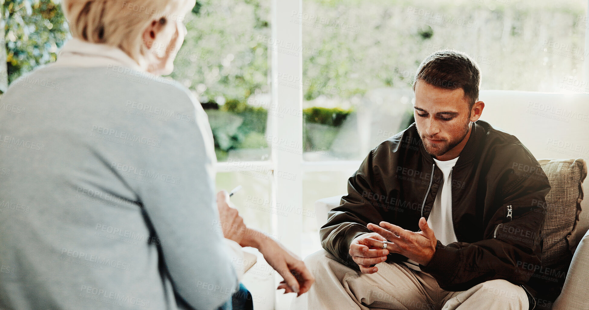 Buy stock photo Psychology, therapist and man in marriage counseling, stress for mental health evaluation. Therapy session, patient and person with ring, divorce anxiety and help to process separation in office