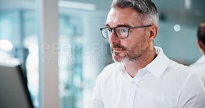 Buy stock photo Business, man and reading on computer in office for insurance auditing, finance news and research. Serious, mature financial advisor and tech for monitoring trends, CRM update and wealth management