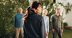 Coach, stretching and old people in park for fitness, body mobility and workout outdoor. Group, trainer or mature friends in warm up together for training, exercise or retirement community in nature
