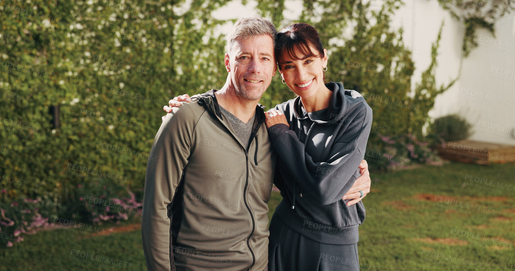 Buy stock photo Portrait, couple and hug in backyard for fitness, love and partner support for health benefits. Smile, mature people and embrace at house for pilates, morning hobby and bonding together for wellness