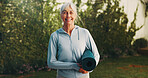 Backyard, portrait and senior woman with yoga mat for exercise, wellness and active for health. Morning, happy and person with equipment for pilates, fitness routine and hobby for wellbeing outdoor