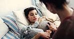 Sick, bedroom and mom with child for comfort with infection, virus and recovery in home. Family, house and mother with boy on bed with cold, flu and resting for illness, healing and support together