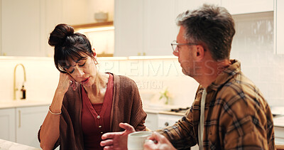 Buy stock photo Annoyed, couple and arguing in home with stress, disagreement and confrontation for cheating. Frustrated, mature people and coffee at house with conflict, misunderstanding and toxic relationship