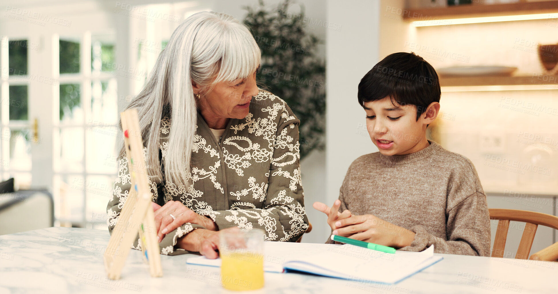 Buy stock photo Child, grandma and help with homework, support and book for math, knowledge or education in home. People, grandmother and boy for counting, learning and studying for development at family house