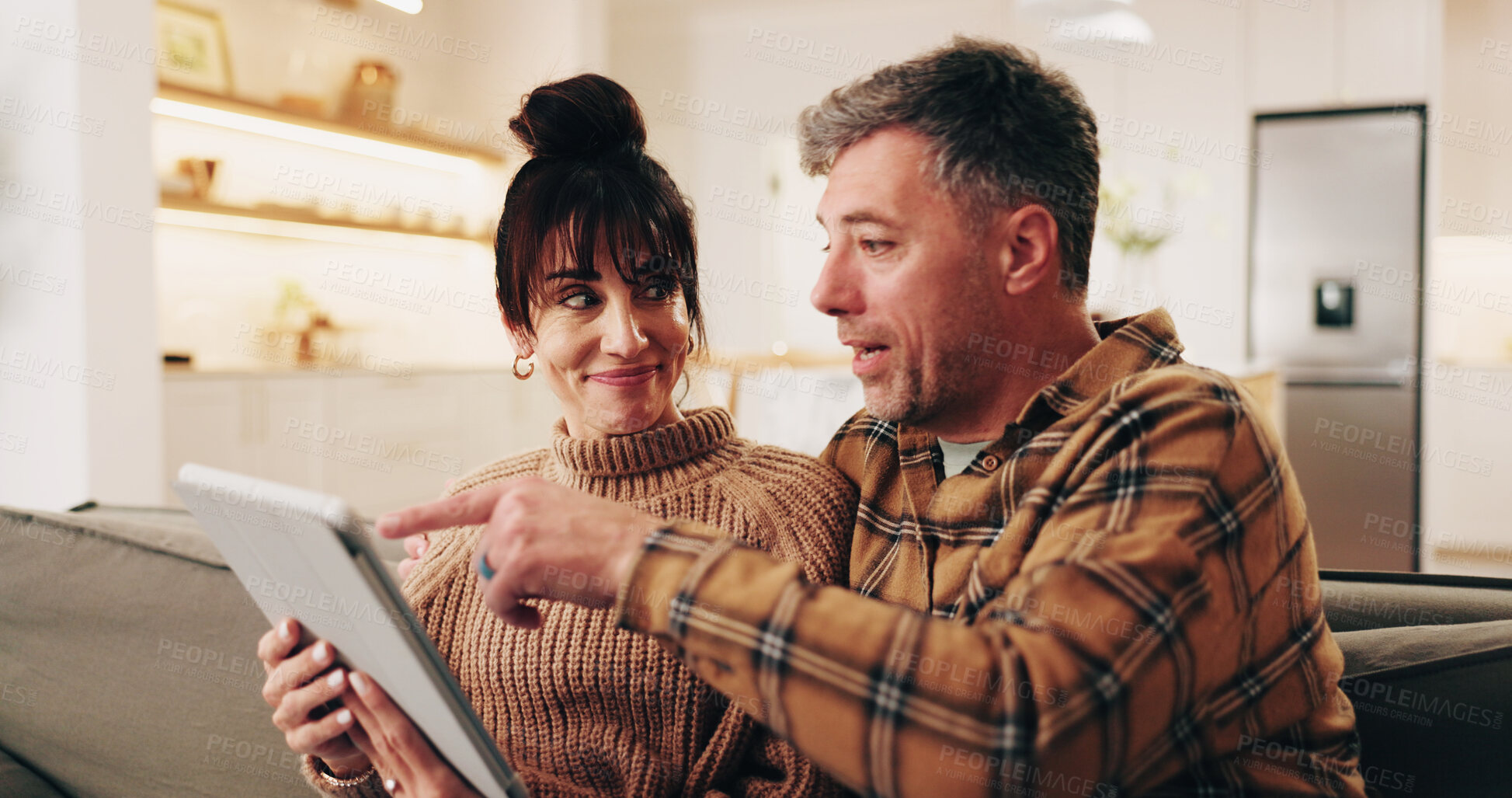 Buy stock photo Smile, couple and reading in home with tablet, good news or email announcement for lottery winner. Happy, mature people and notification at house with digital, social media and giveaway prize on sofa