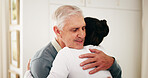 Hug, nurse and senior man in home for rehabilitation, healthcare or support at consultation. Happy, trust and caregiver embracing elderly person in retirement for comfort at medical checkup in house.