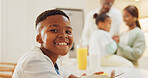 Portrait, child and relax in kitchen with cereal, breakfast and morning routine for nutrition. Smile, family or kid in home with healthy porridge, fiber meal and dairy protein with calcium for growth