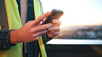 Person, hands and contractor with phone on balcony in city for network, communication or signal. Technician, texting or smartphone with lens flare for online connection, mobile test or app in town