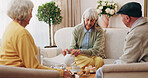 Friends, tea party and gossip with old people in home for bonding, retirement and together. Drinks, relax and social reunion with senior group in living room for breakfast, visit or chat in house