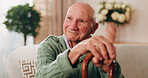 Cane, reflection and smile of old man on sofa in living room of home for retirement or wellness. Break, thinking and walking stick with happy senior in apartment for optimism, peace or satisfaction